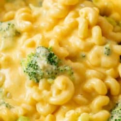 A spoon scooping up one pot broccoli mac and cheese.